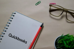 Quickbooks write on a book isolated on Office Desk