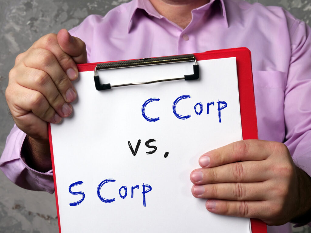 Financial concept meaning C Corp vs. S Corp with inscription on the piece of paper.