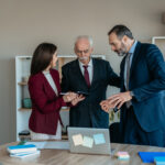 Senior Businessman with Son and Daughter in Modern Office – Family Business Transition