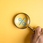 Percentage sign of Magnifier glass focus to percentage icon with percent symbol,  interest rate and business profit growth concept.