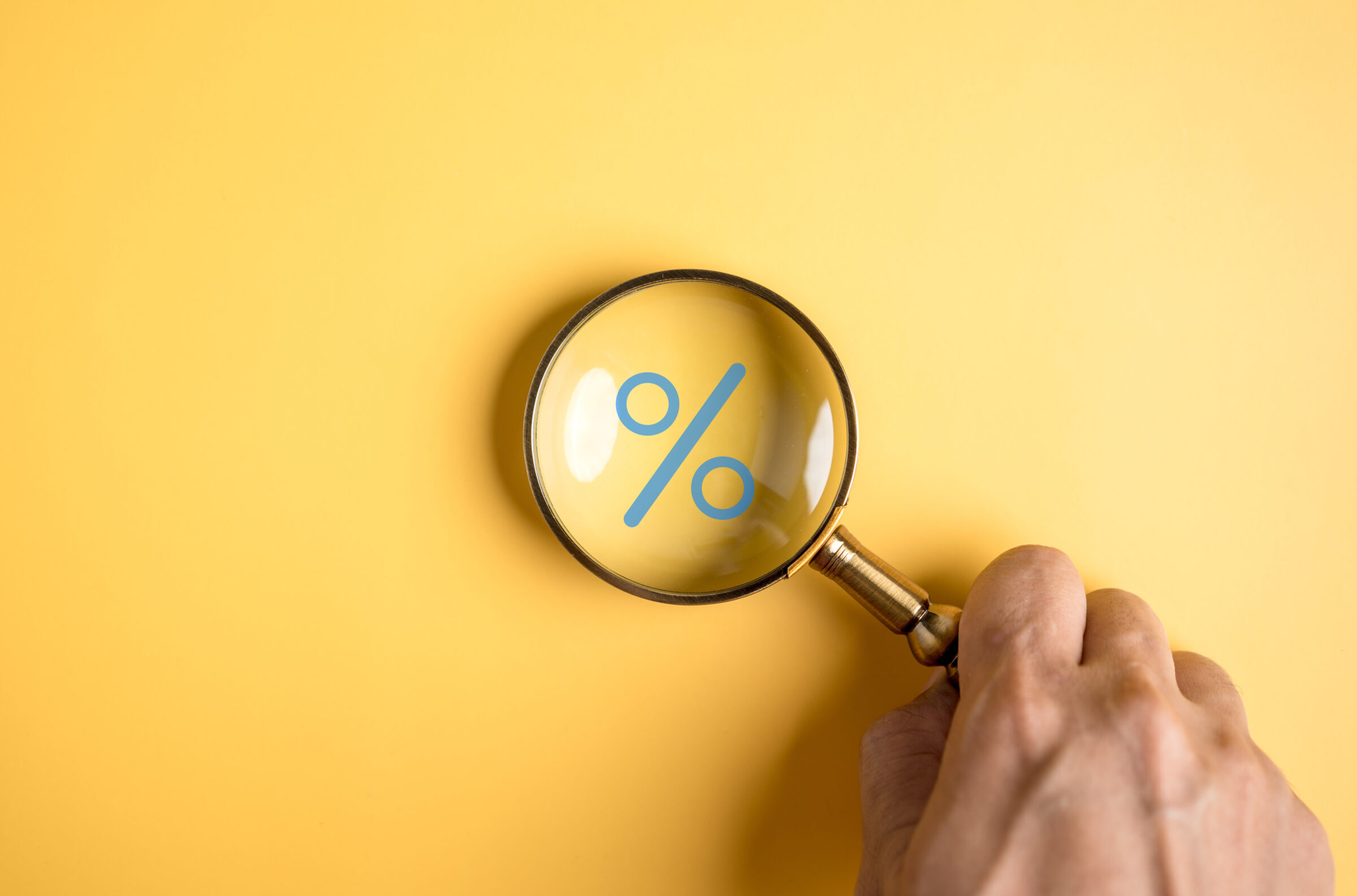 Percentage sign of Magnifier glass focus to percentage icon with percent symbol, interest rate and business profit growth concept.